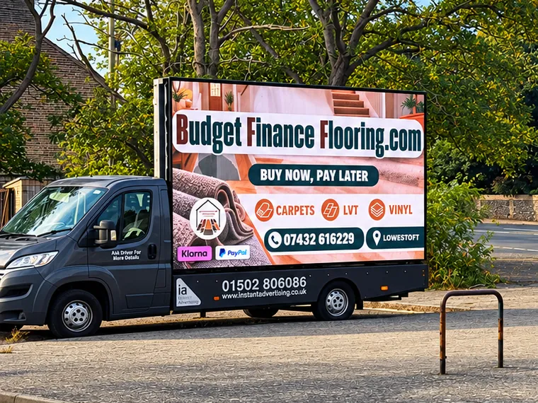 The digivan showing a Budget Finance Flooring advert for carpets, LVT and vinyl with buy now, pay later